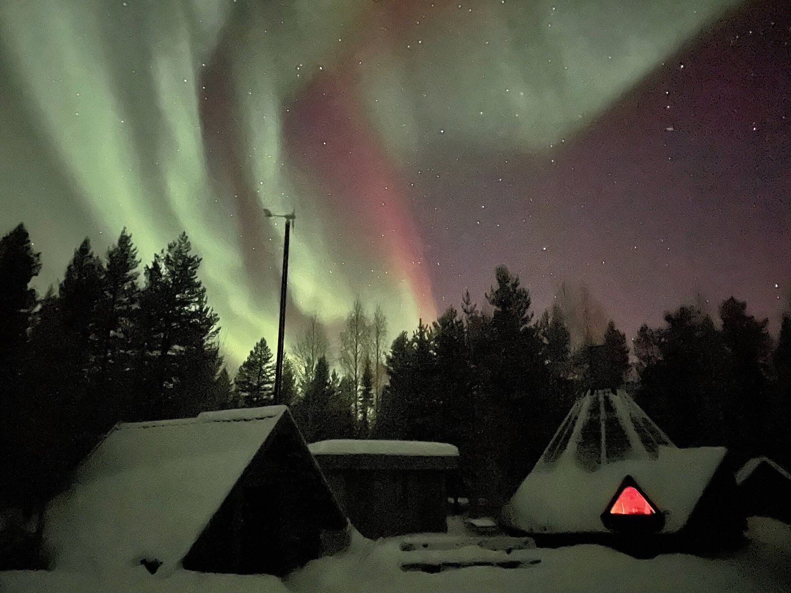Northern lights over the forests of Swedish Lapland